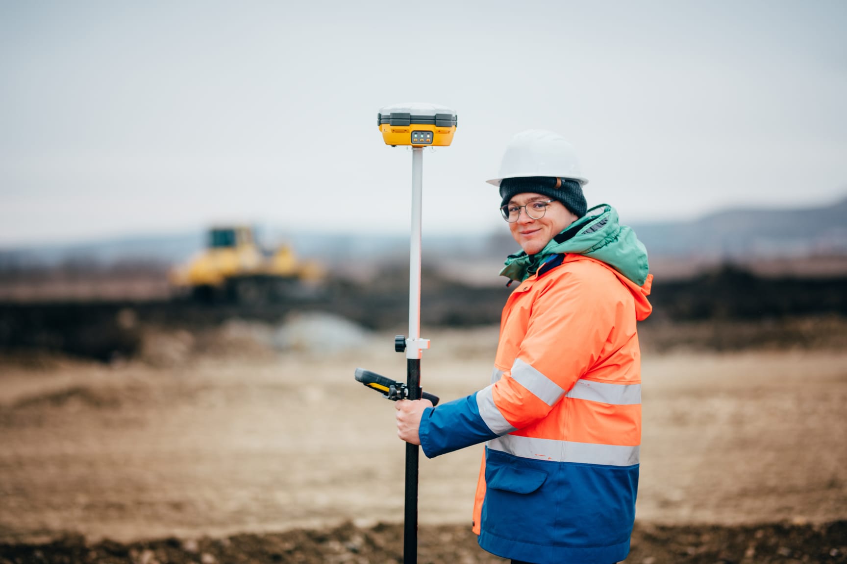 Surveyor with gps on construction site