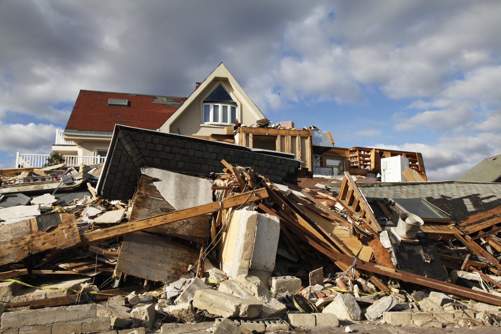 A picture of a house that has been destroyed by a major weather incident
