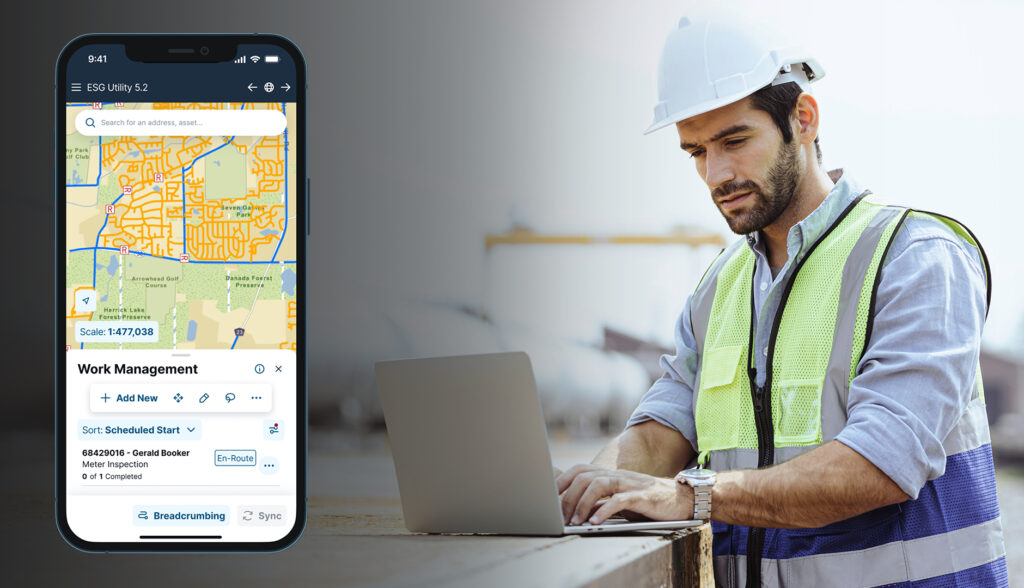 Man in hard hat working on computer