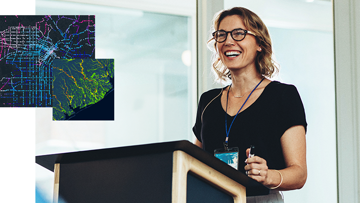 a gis professional presents maps from a podium