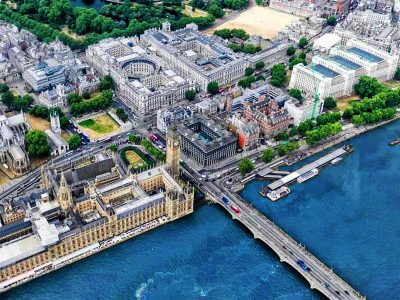 A digital twin of an aerial view of London, England, showing the River Thames, Houses of Parliament, and Big Ben.