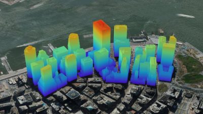 Un rendering 3D di una città che mostra gli edifici evidenziati in diversi colori che rappresentano le loro altezze, dove il rosso è il più alto e il blu il più basso.